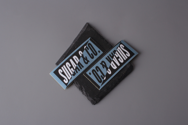 Sugar & Co. logo sticker.