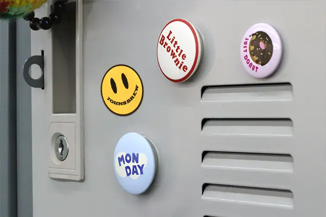 Custom round magnets displayed on a metal locker to show creative placement.