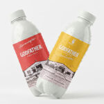 Red and yellow "Godfather" beverage labels on condensation-covered bottles.