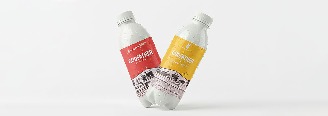 Red and yellow "Godfather" beverage labels on condensation-covered bottles.