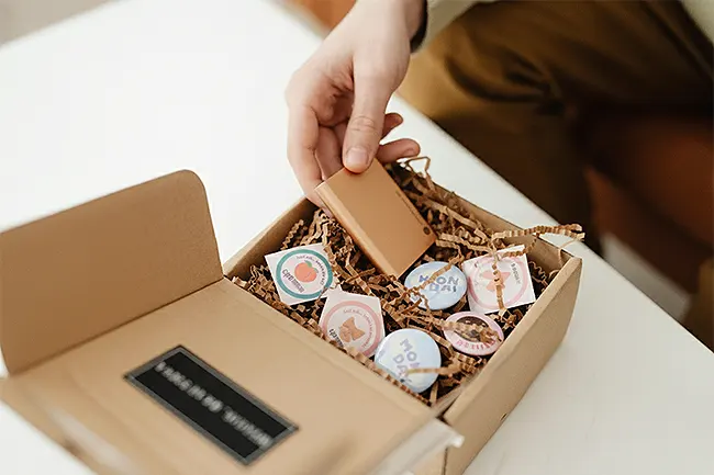 A gift box filled with promotional items.