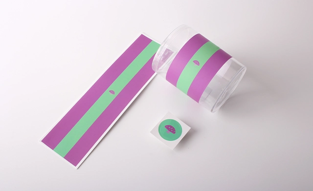 Minimalist purple and green brand labels on a glass jar.
