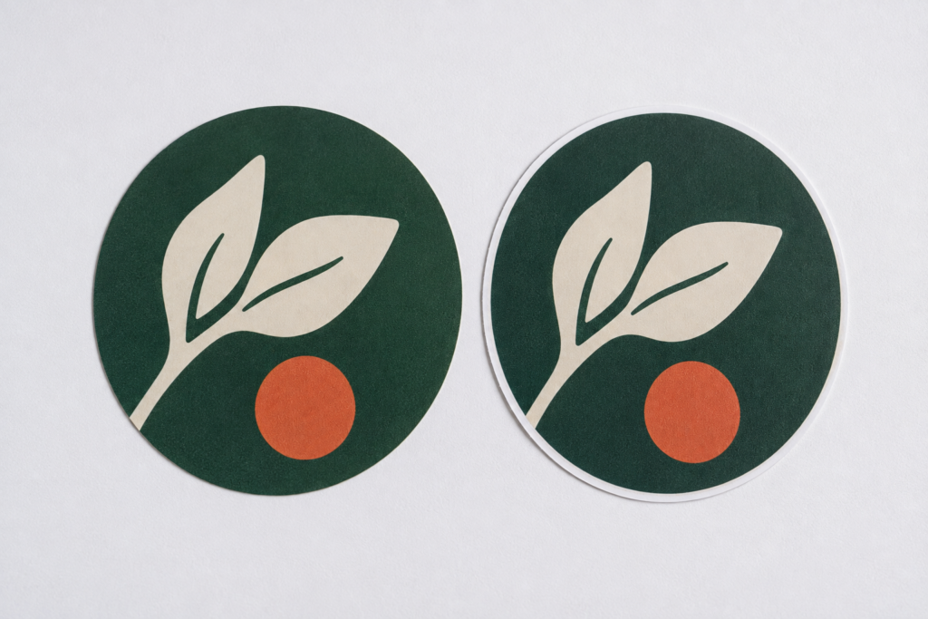 Two circular sticker samples showing full bleed vs bordered cut designs.