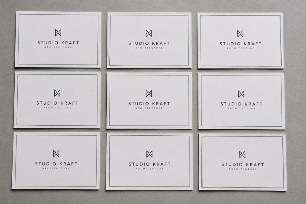 A grid of Studio Kraft architecture business cards showing margin alignment without bleed in print.